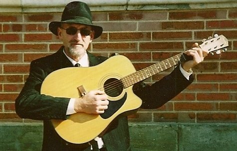 Jim Bruce Playing Blues Guitar In The Street